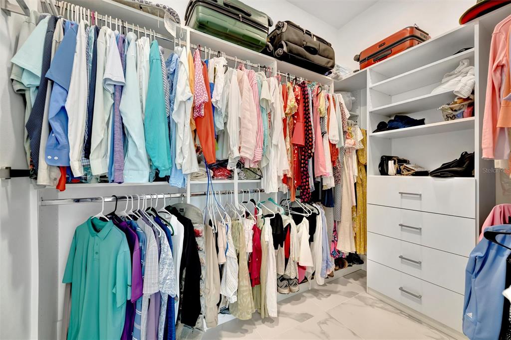 916 Highland Street Sarasota, FL 34234 - Photo 19 of 48 a view of walk in closet with clothes