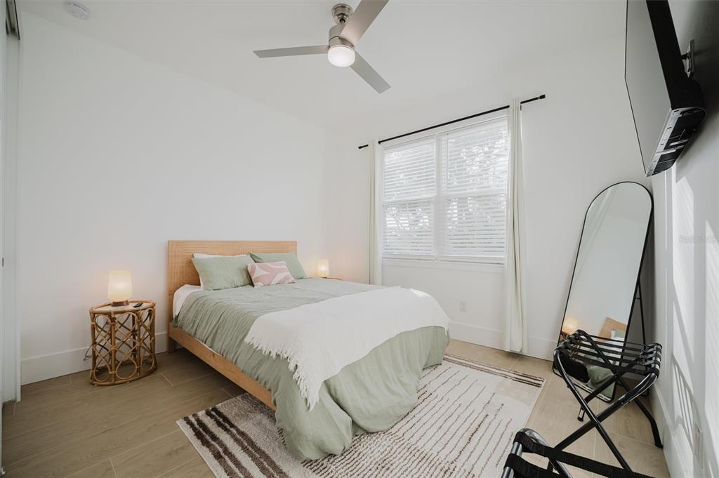 916 Highland Street Sarasota, FL 34234 - Photo 26 of 48 a bedroom with a bed and a window