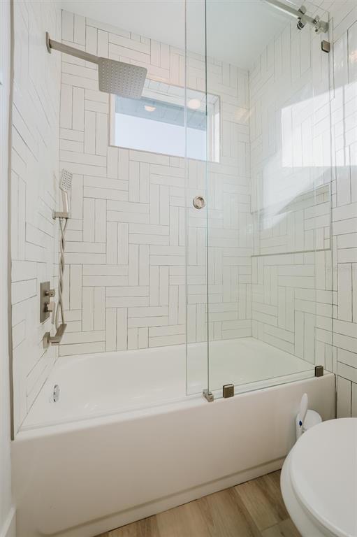 916 Highland Street Sarasota, FL 34234 - Photo 33 of 48 a bathroom with a bathtub and a shower