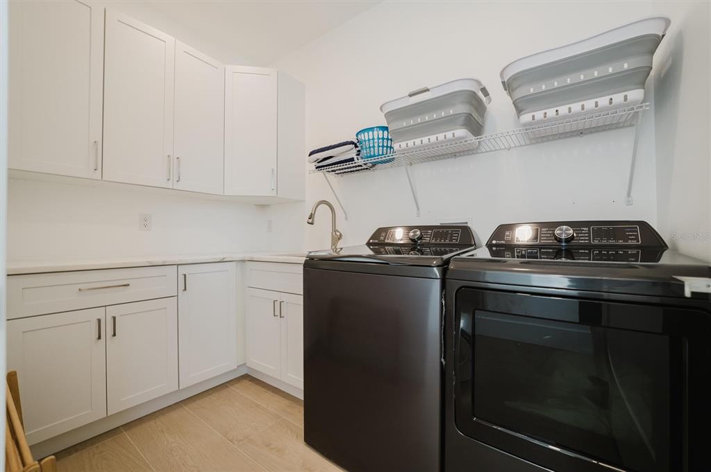 916 Highland Street Sarasota, FL 34234 - Photo 38 of 48 a view of a kitchen with cabinets and appliances