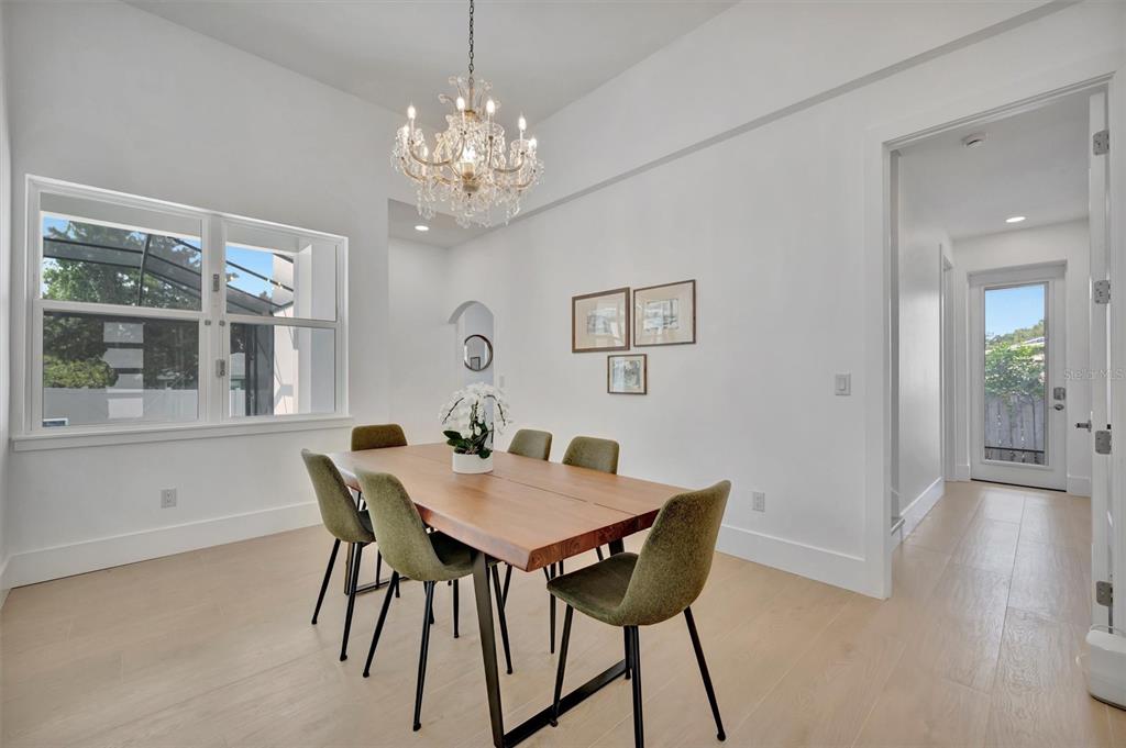 916 Highland Street Sarasota, FL 34234 - Photo 6 of 48 a view of a dining room with furniture and chandelier