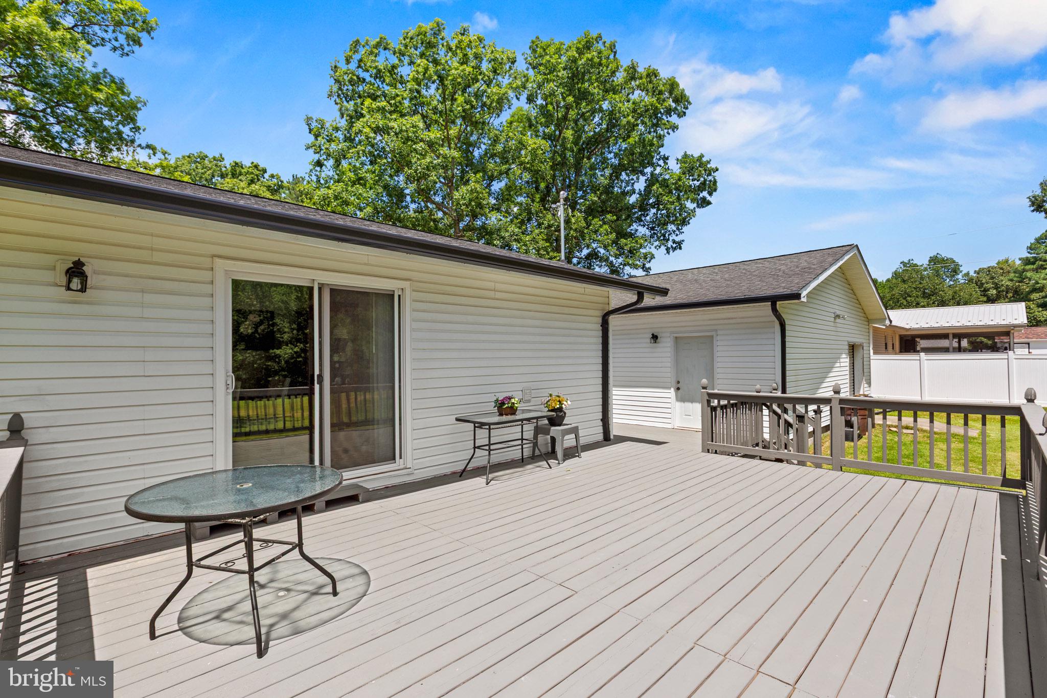 22508 Old Rolling Road California, MD 20619 - Photo 26 of 34 Sunny deck with serene backyard views.