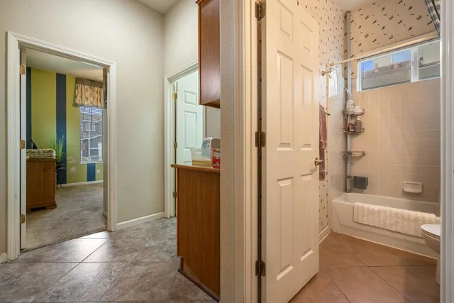 a bathroom with a tub and shower