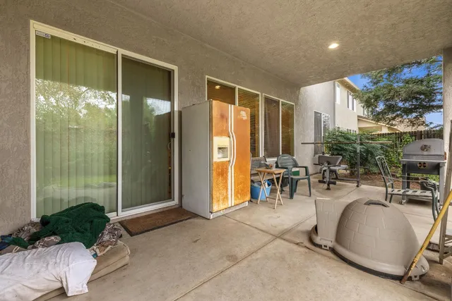 a lobby with furniture and potted plants