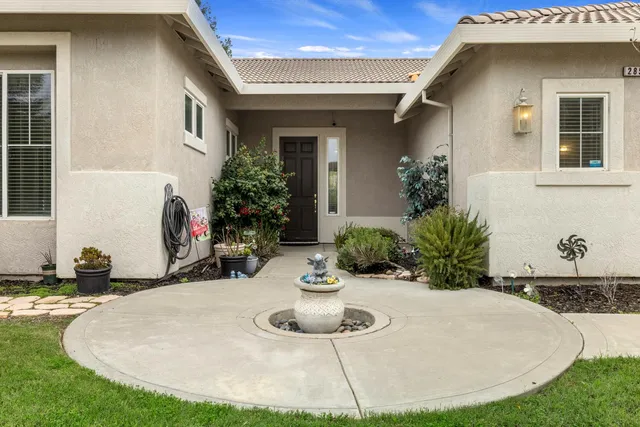 a view of a house with outdoor kitchen