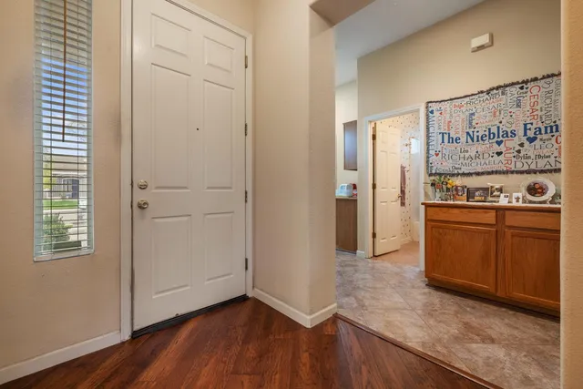 a view of a kitchen with wooden floor