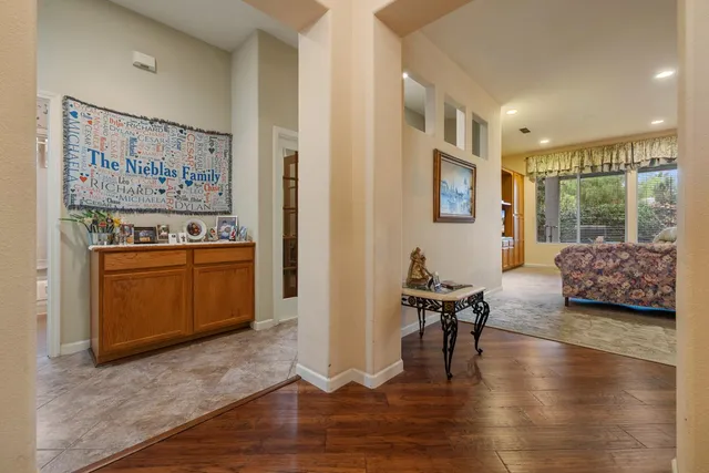 a view of a livingroom with furniture and staircase