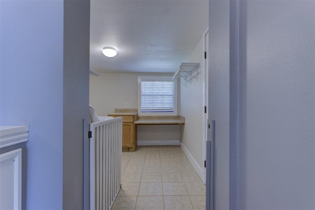 209 Case Street Weatherford, TX 76086 - Photo 13 of 25 laundry with storage