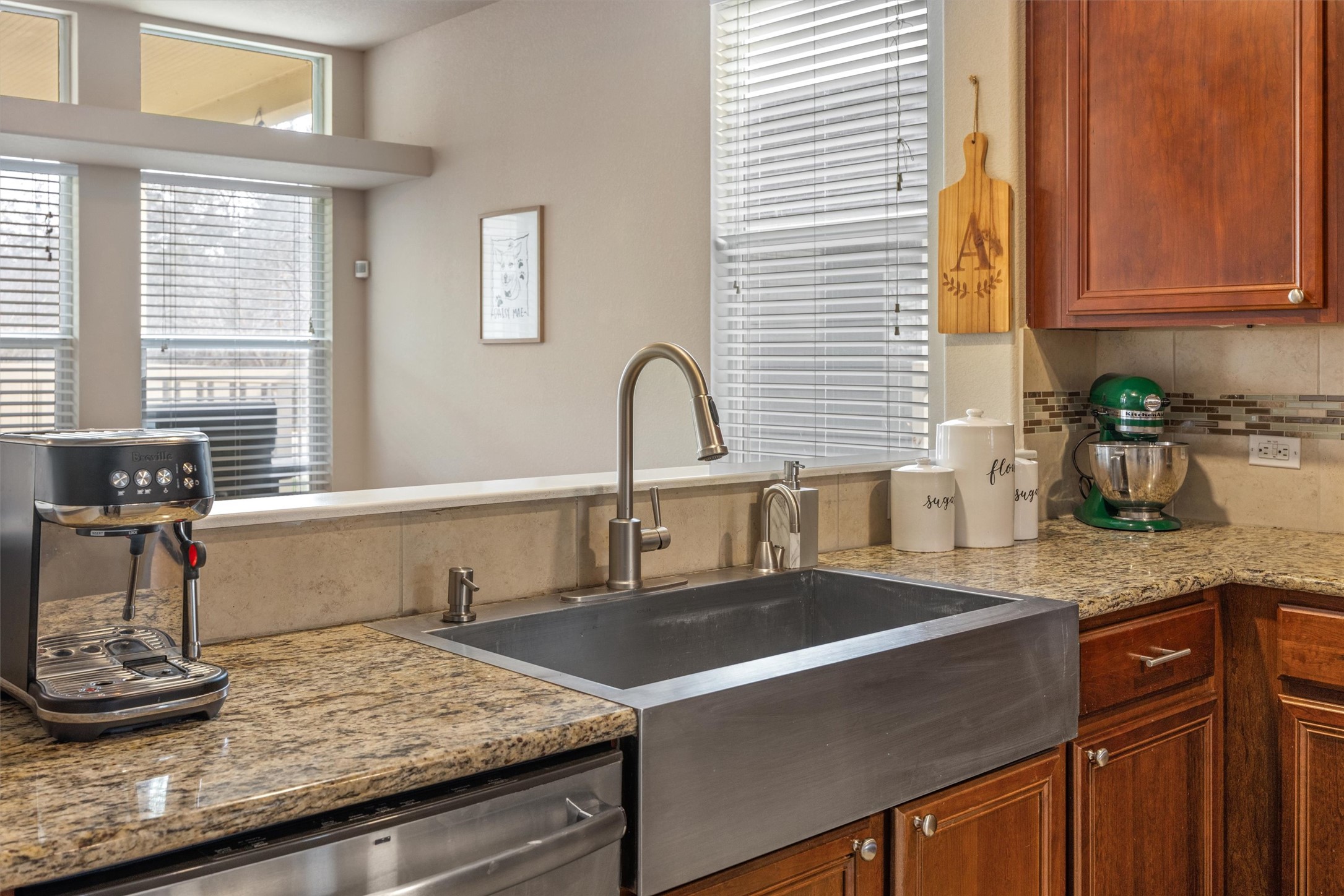 1117 Nevarez Kyle, TX 78640 - Photo 13 of 32 a kitchen with granite countertop a sink and a stove