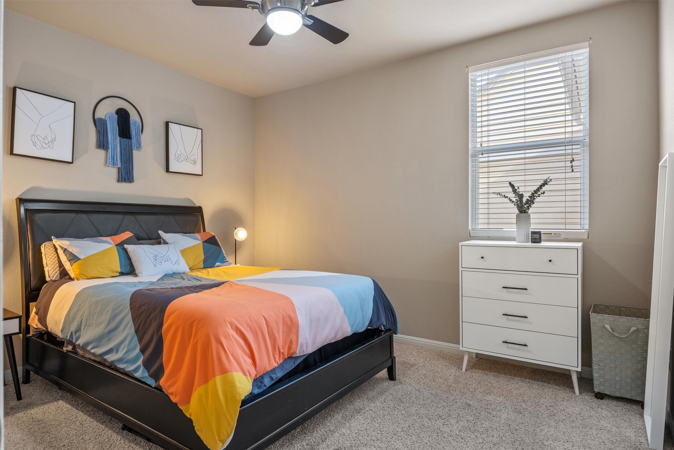 1117 Nevarez Kyle, TX 78640 - Photo 18 of 32 a bedroom with a bed and a chandelier