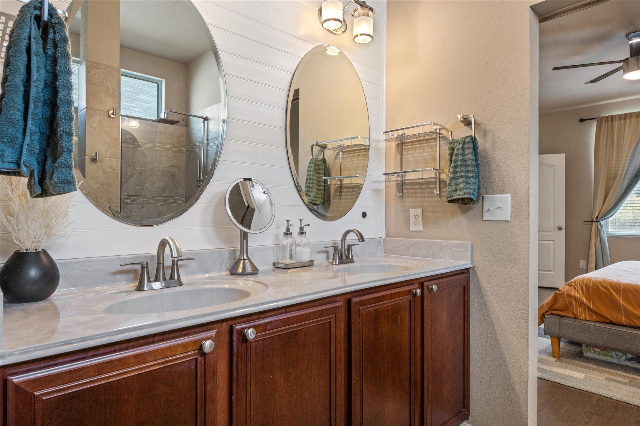 1117 Nevarez Kyle, TX 78640 - Photo 27 of 32 a bathroom with a double vanity sink and a mirror