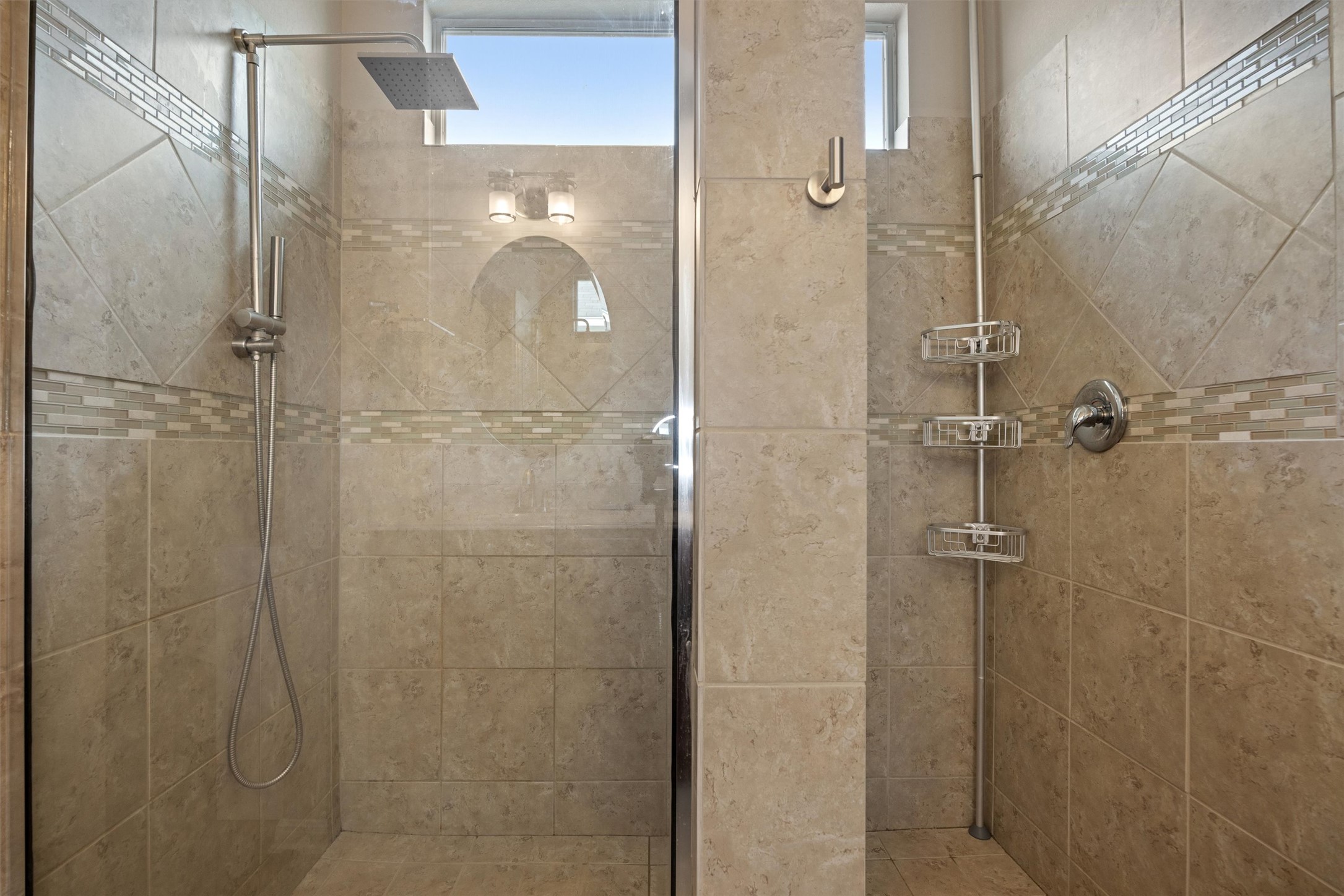 1117 Nevarez Kyle, TX 78640 - Photo 28 of 32 a bathroom with a glass shower door