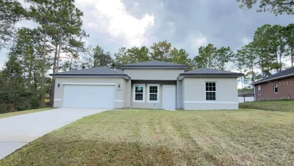 front view of a house with a yard