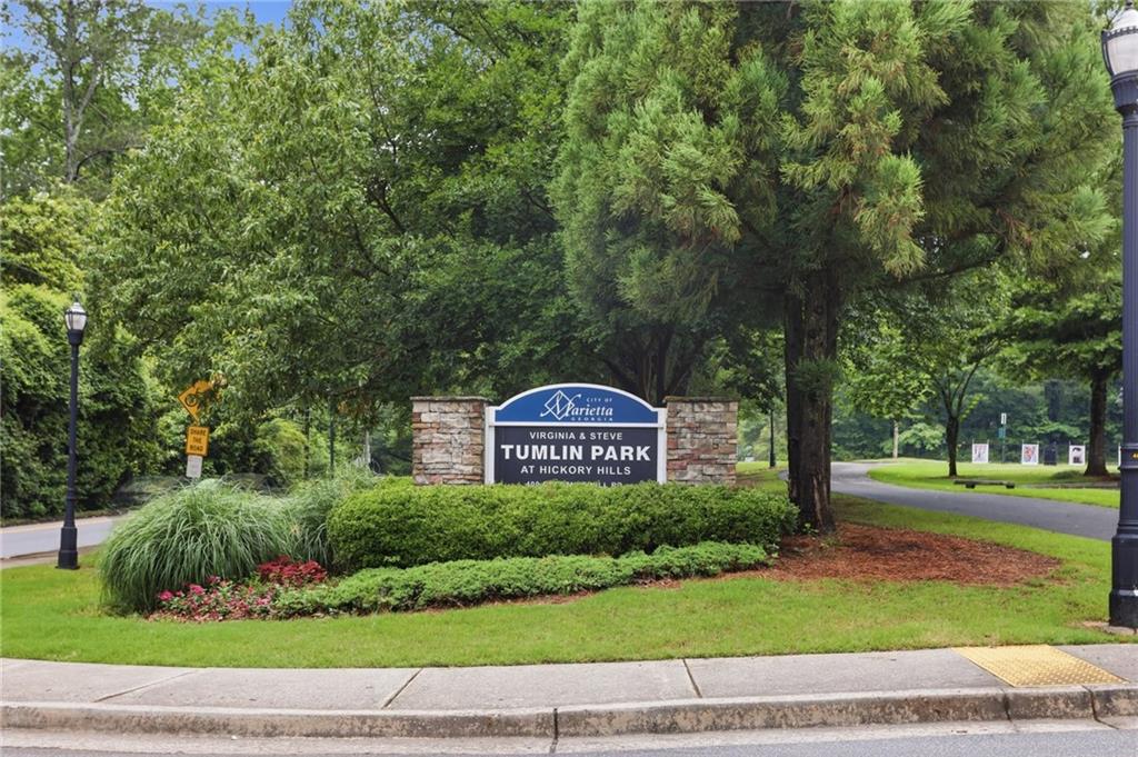 413 Promenade Court Marietta, GA 30064 - Photo 25 of 28 a view of a park with a bench and trees