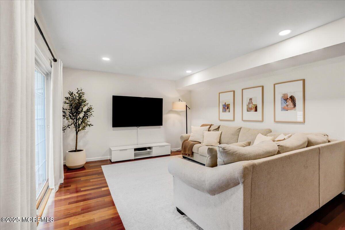 7 Hawk Court Howell, NJ 07731 - Photo 12 of 32 a living room with furniture and a flat screen tv