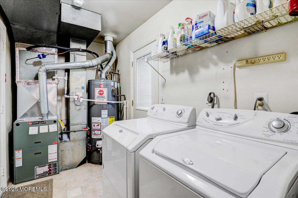 7 Hawk Court Howell, NJ 07731 - Photo 15 of 32 a utility room with dryer and washer