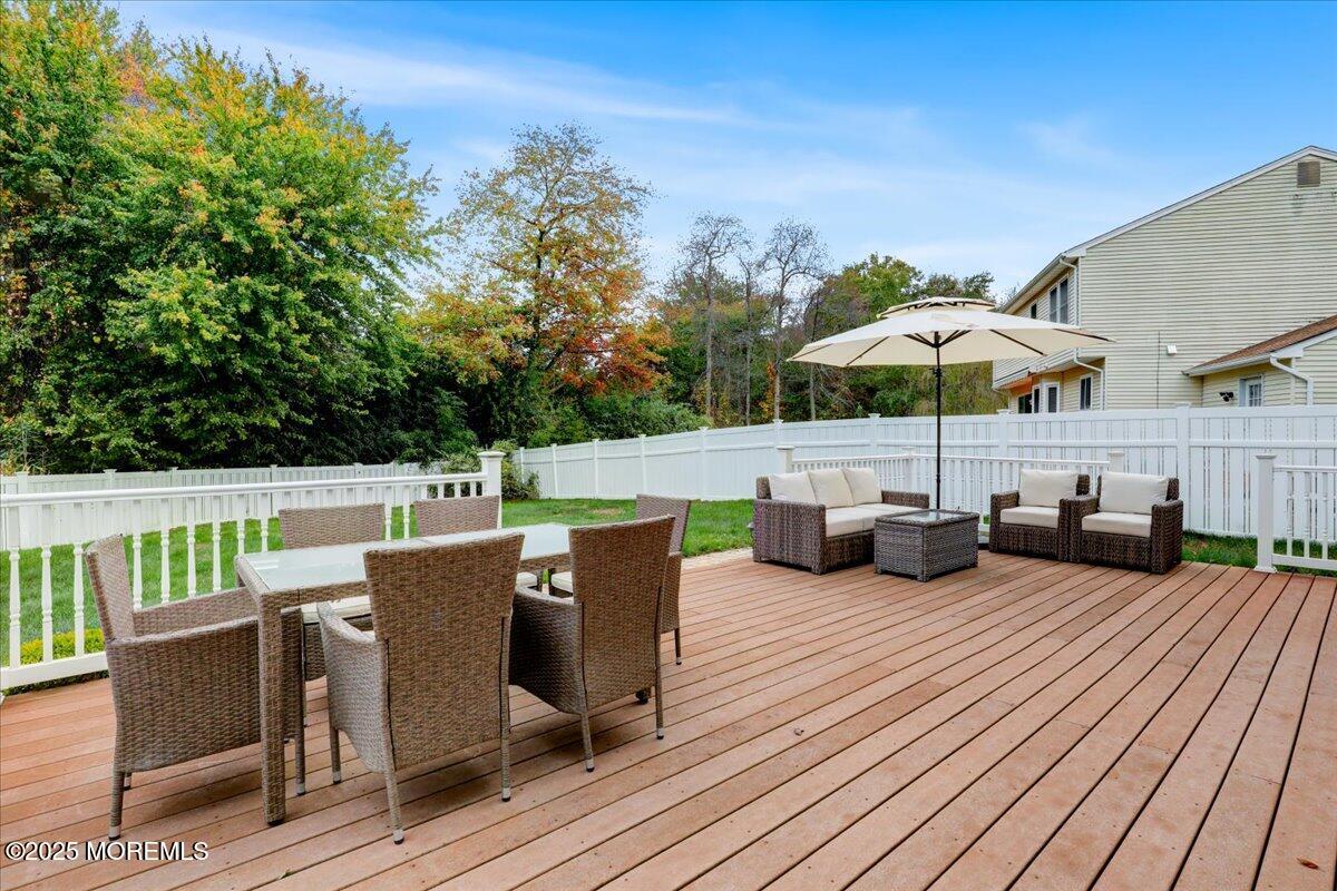 7 Hawk Court Howell, NJ 07731 - Photo 25 of 32 a view of a patio with wooden floor