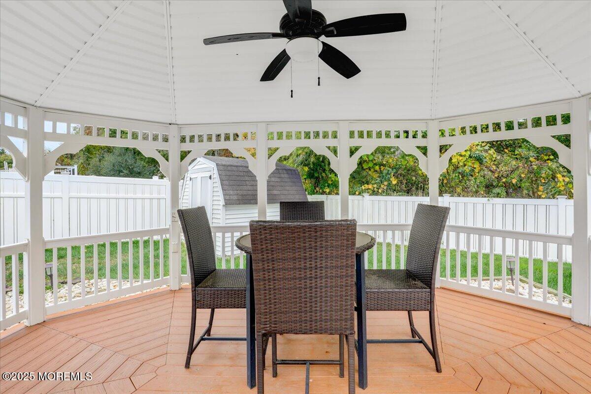 7 Hawk Court Howell, NJ 07731 - Photo 29 of 32 a view of a patio with a table and chairs