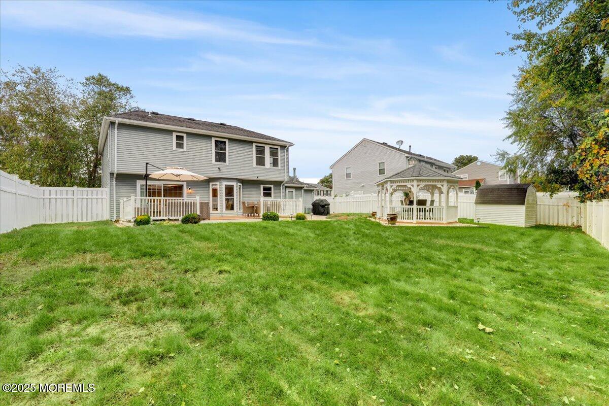 7 Hawk Court Howell, NJ 07731 - Photo 31 of 32 a front view of a house with a yard and trees