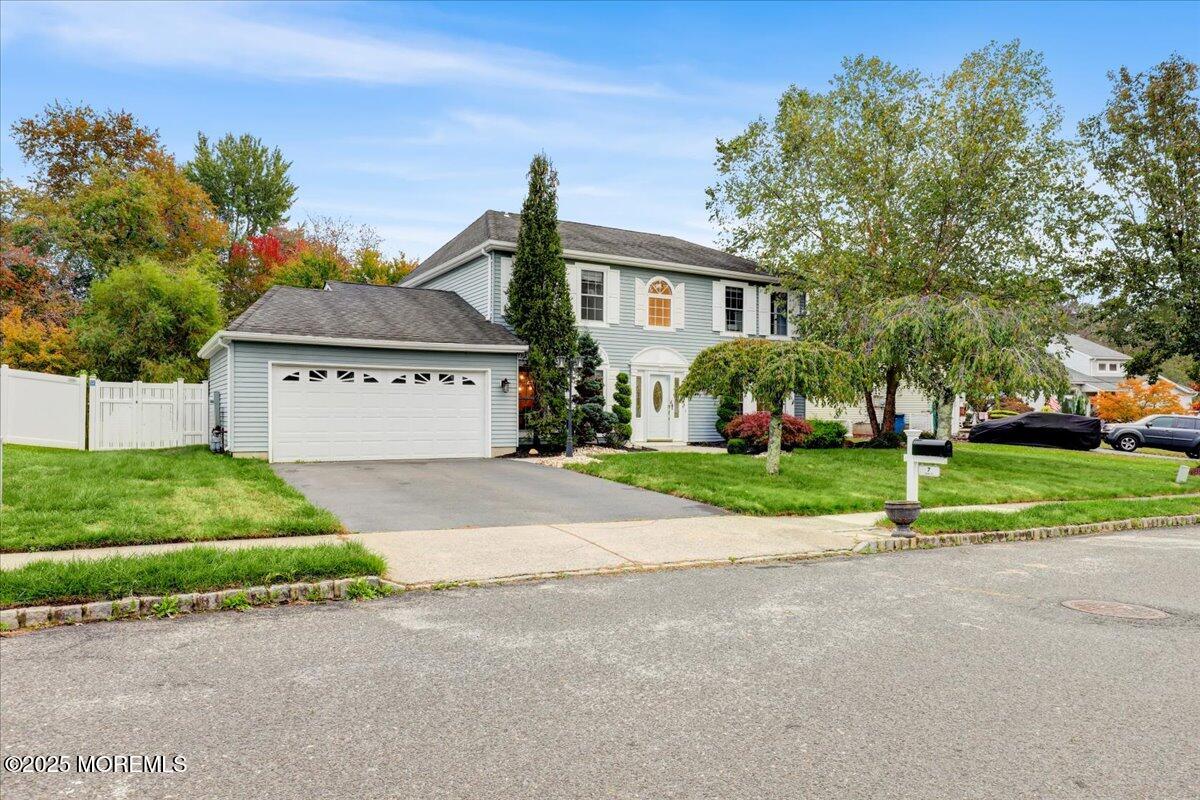 7 Hawk Court Howell, NJ 07731 - Photo 4 of 32 a front view of a house with a yard and garage