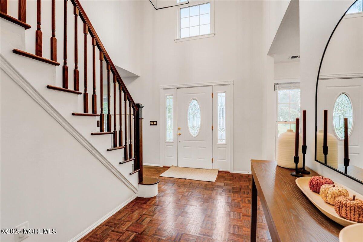 7 Hawk Court Howell, NJ 07731 - Photo 6 of 32 a view of front door with hallway and wooden floor