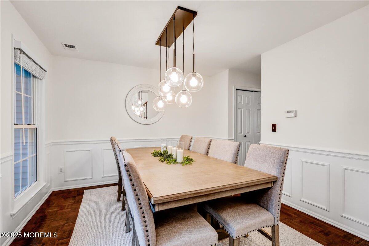 7 Hawk Court Howell, NJ 07731 - Photo 8 of 32 a view of a dining room with furniture and wooden floor