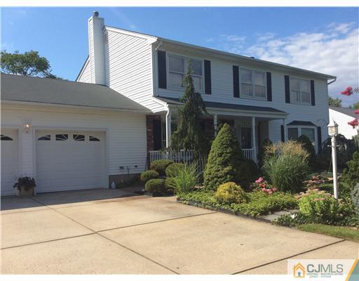 619 Lloyd Road Aberdeen, NJ 07747 - Photo 1 of 8 a view of a house with a garden