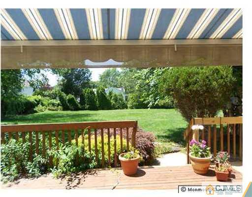 619 Lloyd Road Aberdeen, NJ 07747 - Photo 3 of 8 a street view with sitting space and garden view