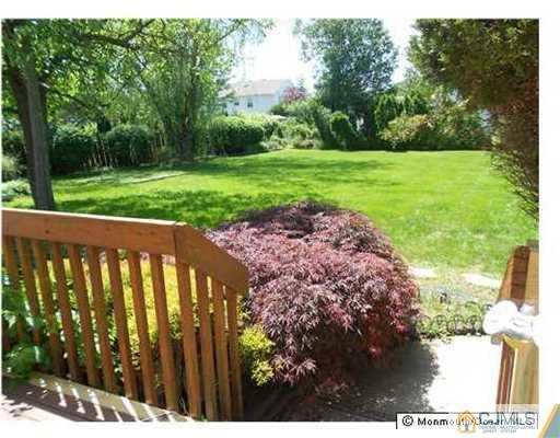 619 Lloyd Road Aberdeen, NJ 07747 - Photo 4 of 8 a view of a backyard with pathway