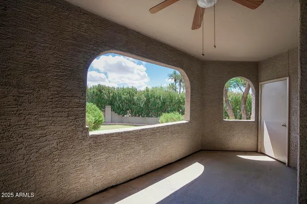 an empty room with windows and mountain view