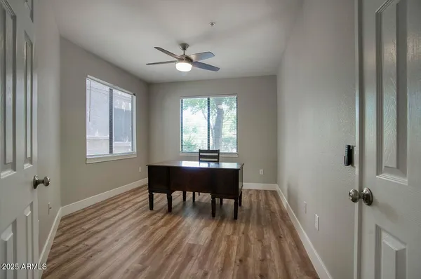 a large bed sitting in a bedroom next to a window