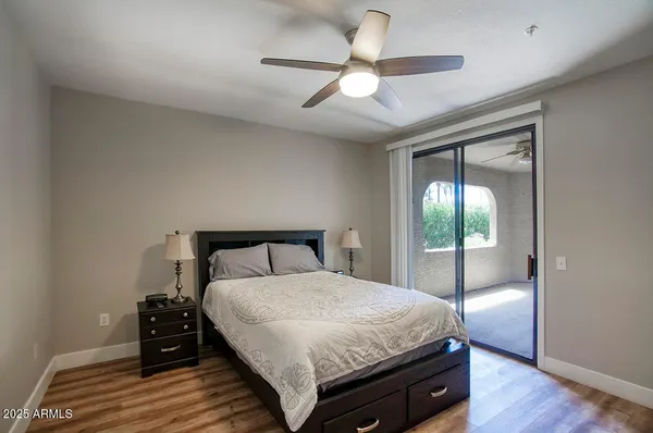 a bathroom with a shower sink and mirror