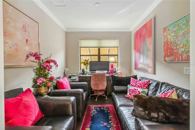 a living room with furniture and a potted plant