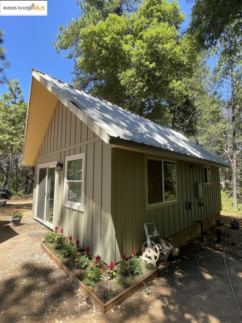 15003 Alleghany Road North San Juan, CA 95960 - Photo 1 of 27 a view of a small house with yard