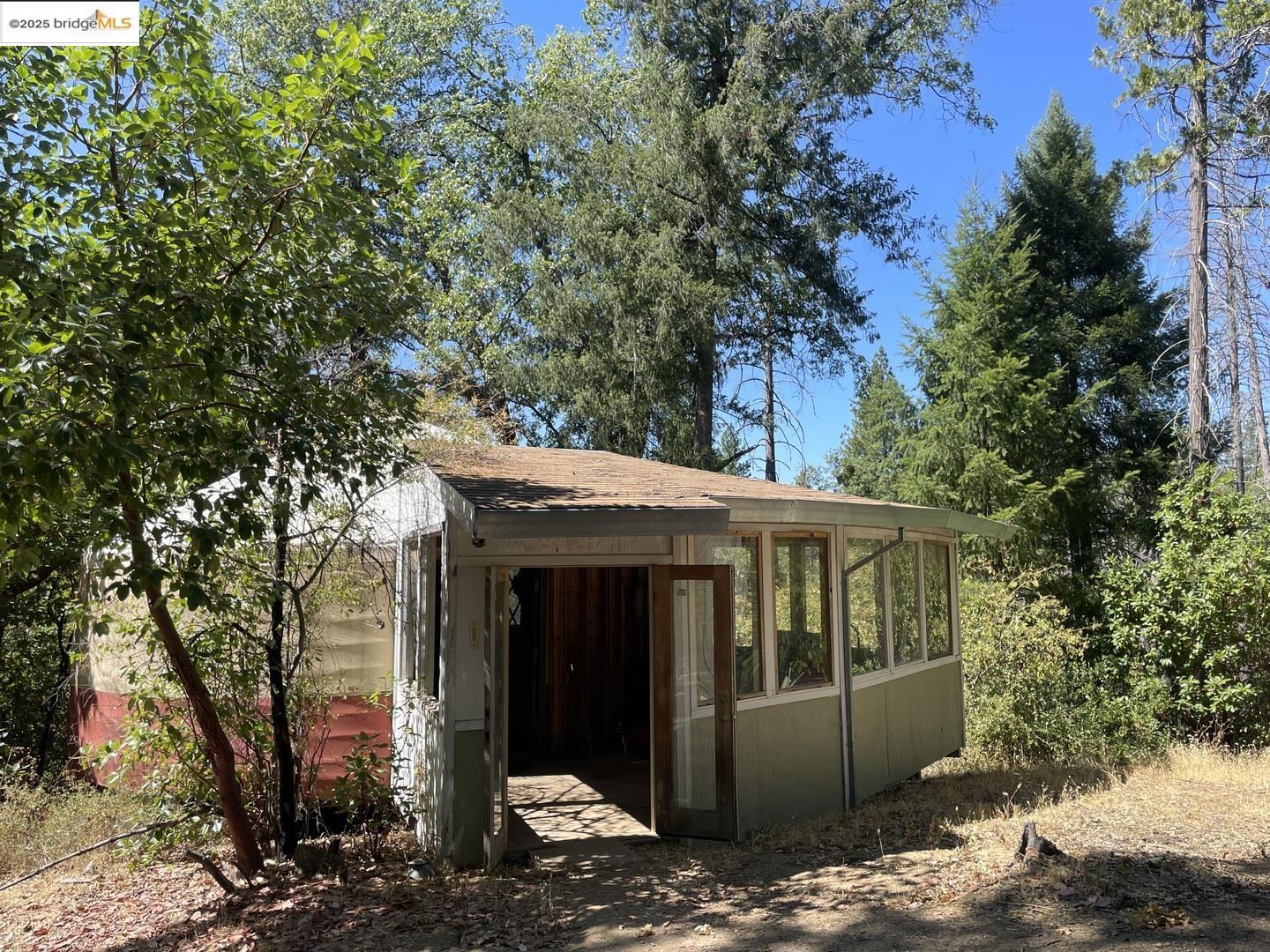 15003 Alleghany Road North San Juan, CA 95960 - Photo 27 of 27 a view of a house with a tree and wooden fence