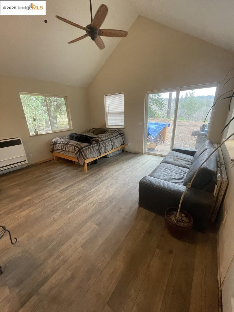 15003 Alleghany Road North San Juan, CA 95960 - Photo 5 of 27 a living room with furniture and a floor to ceiling window