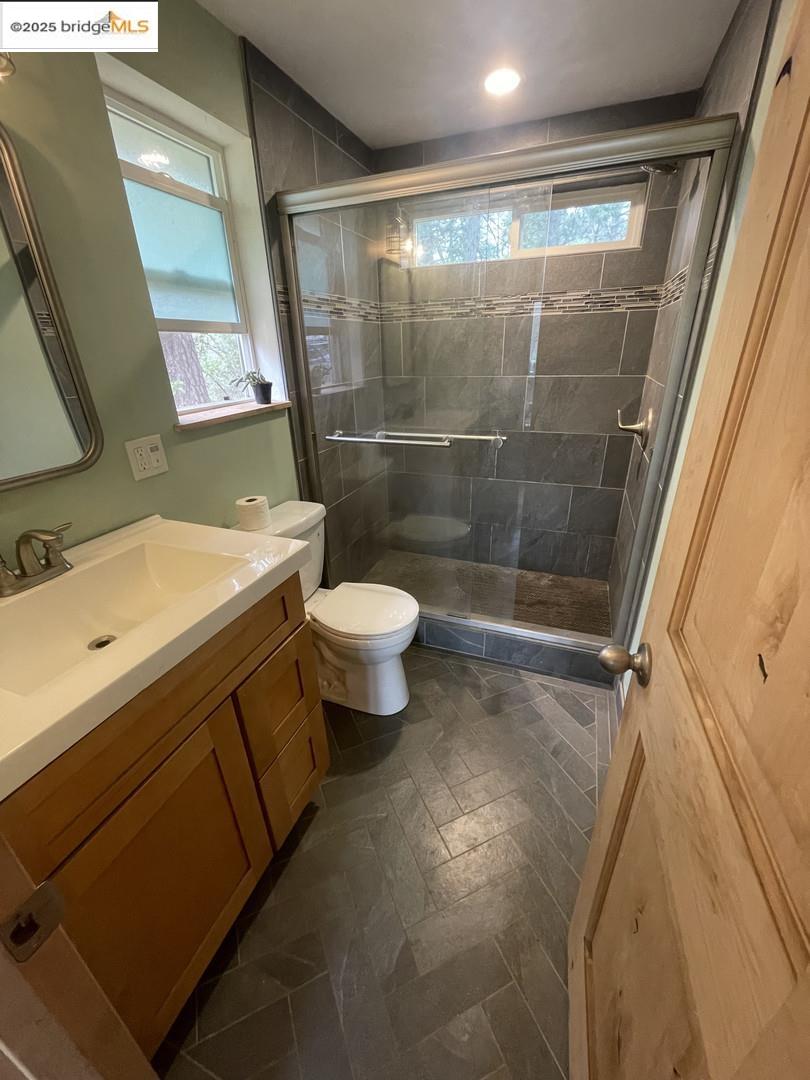 15003 Alleghany Road North San Juan, CA 95960 - Photo 6 of 27 a bathroom with a sink mirror vanity and toilet