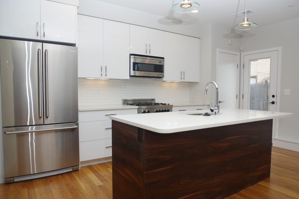178 Thornton Street, Unit 2 Boston, MA 02119 - Photo 1 of 7 a kitchen with a sink stainless steel appliances and refrigerator