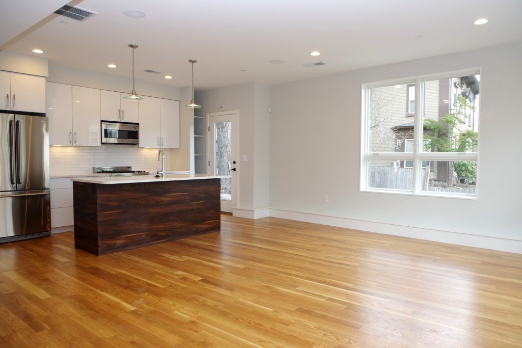 178 Thornton Street, Unit 2 Boston, MA 02119 - Photo 2 of 7 a kitchen with stainless steel appliances granite countertop a sink and a stove