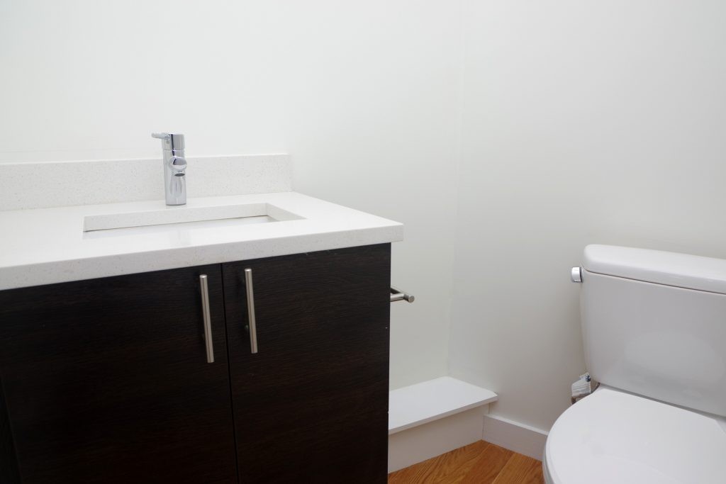 178 Thornton Street, Unit 2 Boston, MA 02119 - Photo 6 of 7 a bathroom with a sink a toilet and mirror