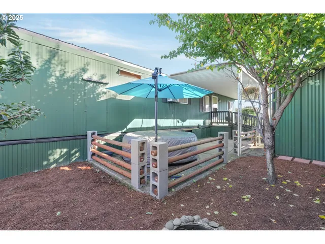 a view of a backyard with a sitting area