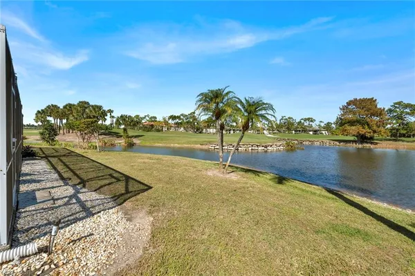 a view of a lake with a yard