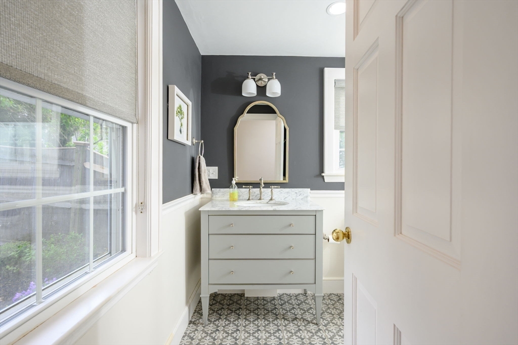 21 Rice Road Hingham, MA 02043 - Photo 14 of 40 a bathroom with a sink and a mirror