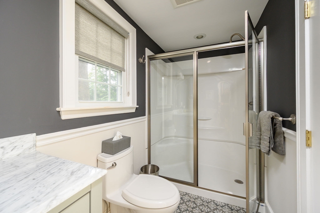 21 Rice Road Hingham, MA 02043 - Photo 15 of 40 a bathroom with a granite countertop sink toilet and shower