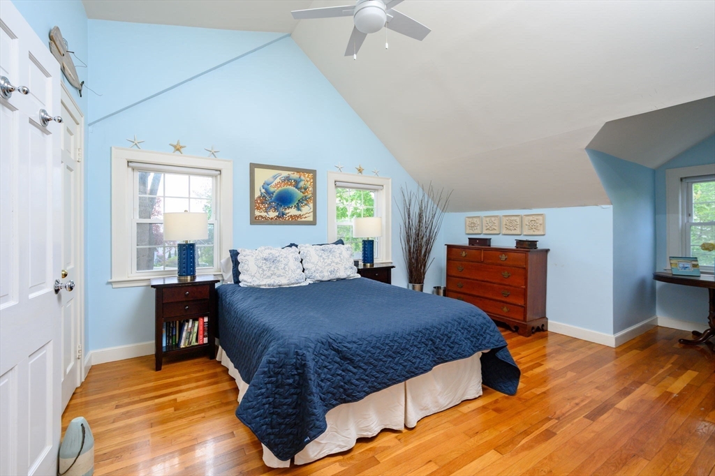 21 Rice Road Hingham, MA 02043 - Photo 17 of 40 a bedroom with a bed and a view of kitchen