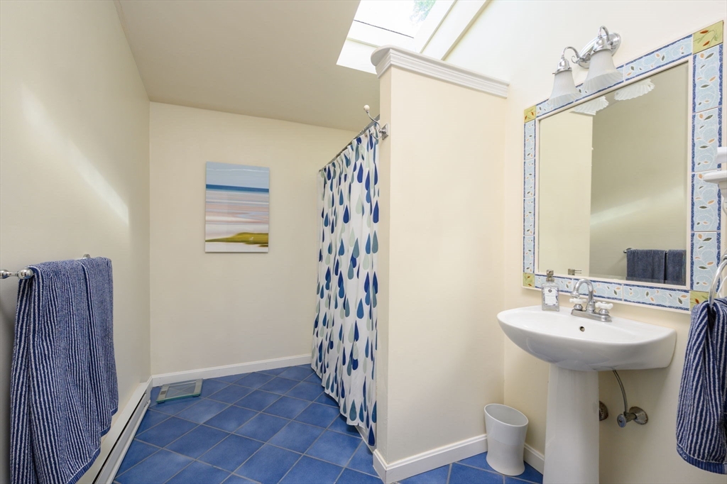 21 Rice Road Hingham, MA 02043 - Photo 20 of 40 a bathroom with a sink a toilet and shower