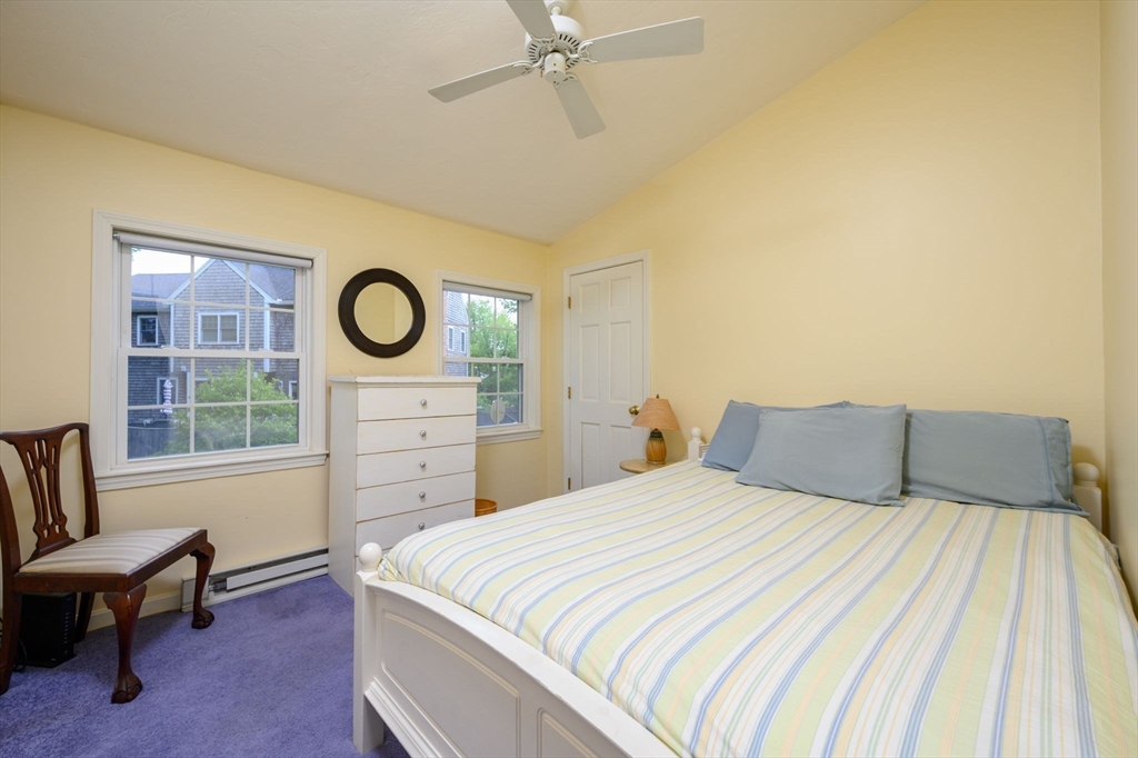 21 Rice Road Hingham, MA 02043 - Photo 22 of 40 a bedroom with a bed a stove and a window
