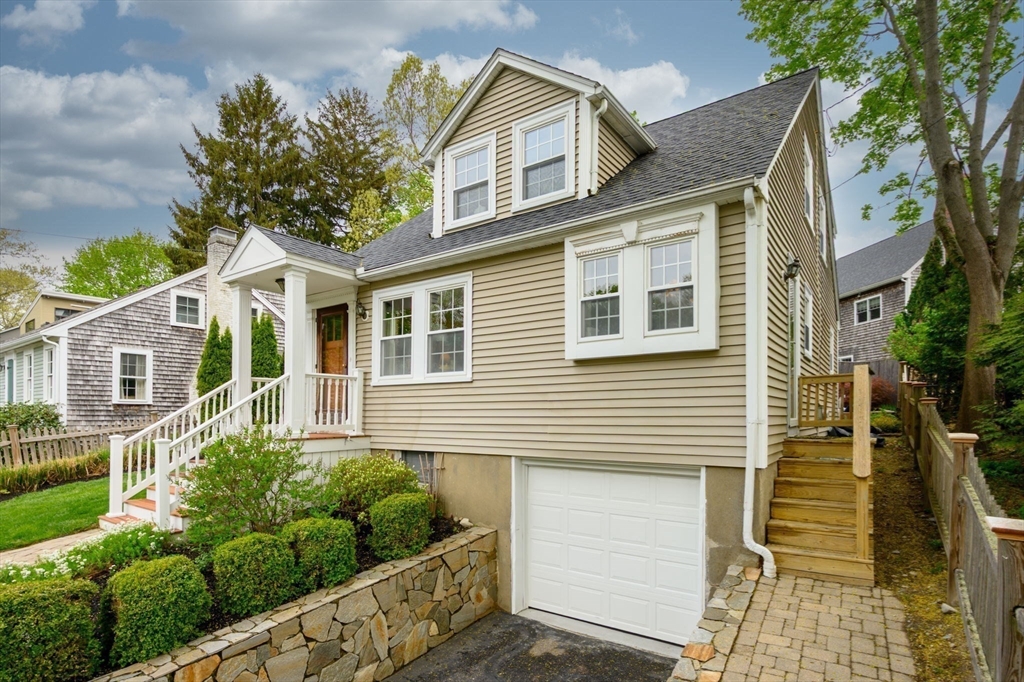 21 Rice Road Hingham, MA 02043 - Photo 34 of 40 a front view of a house with a yard and potted plants