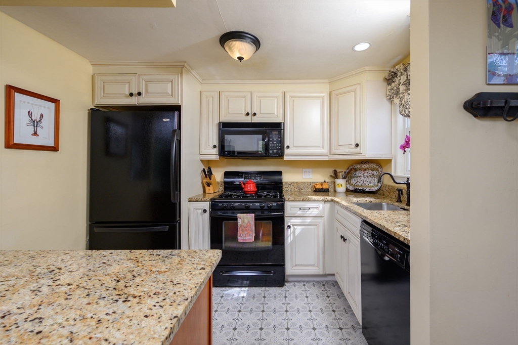 21 Rice Road Hingham, MA 02043 - Photo 5 of 40 a kitchen with stainless steel appliances granite countertop a refrigerator stove and sink