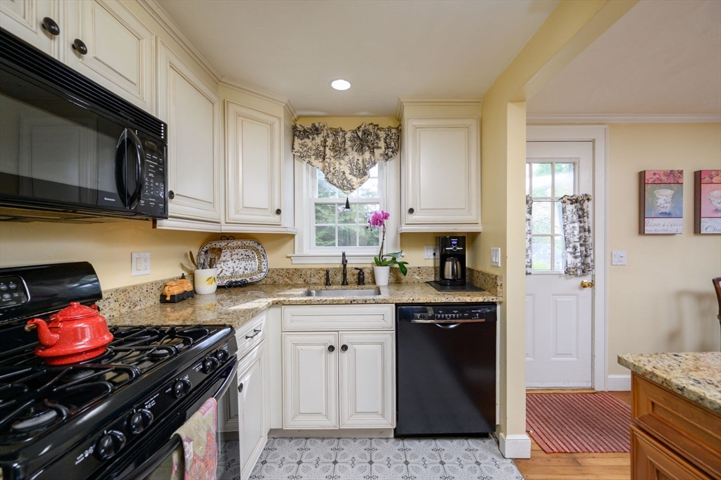 21 Rice Road Hingham, MA 02043 - Photo 6 of 40 a kitchen with a stove a sink and a microwave